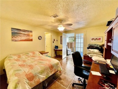 This charming residence boasts numerous delightful features. 2 on Indianwood Golf and Country Club in Florida - for sale on GolfHomes.com, golf home, golf lot