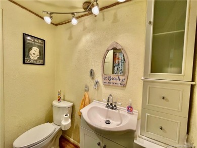 This charming residence boasts numerous delightful features. 2 on Indianwood Golf and Country Club in Florida - for sale on GolfHomes.com, golf home, golf lot