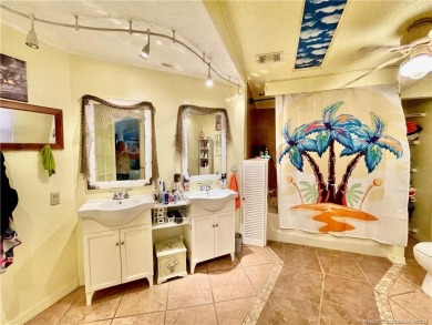 This charming residence boasts numerous delightful features. 2 on Indianwood Golf and Country Club in Florida - for sale on GolfHomes.com, golf home, golf lot