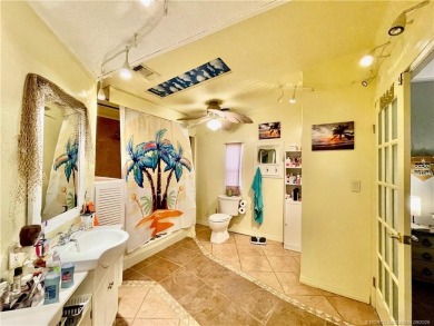This charming residence boasts numerous delightful features. 2 on Indianwood Golf and Country Club in Florida - for sale on GolfHomes.com, golf home, golf lot
