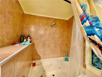 This charming residence boasts numerous delightful features. 2 on Indianwood Golf and Country Club in Florida - for sale on GolfHomes.com, golf home, golf lot