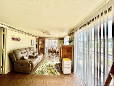 This charming residence boasts numerous delightful features. 2 on Indianwood Golf and Country Club in Florida - for sale on GolfHomes.com, golf home, golf lot