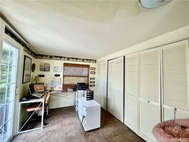 This charming residence boasts numerous delightful features. 2 on Indianwood Golf and Country Club in Florida - for sale on GolfHomes.com, golf home, golf lot