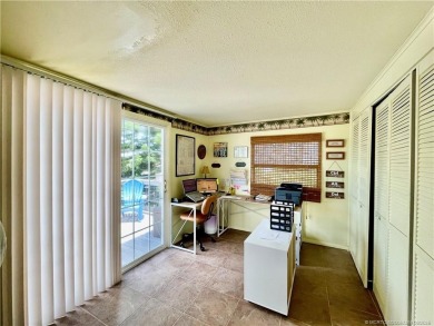 This charming residence boasts numerous delightful features. 2 on Indianwood Golf and Country Club in Florida - for sale on GolfHomes.com, golf home, golf lot