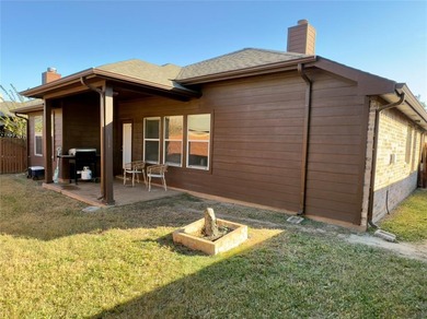 This very beautiful and well maintained 4-bedroom, 2-bath home on Eagle Mountain Country Club  in Texas - for sale on GolfHomes.com, golf home, golf lot