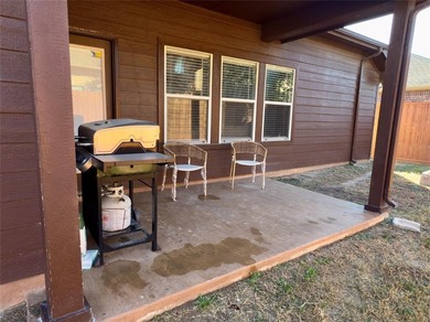 This very beautiful and well maintained 4-bedroom, 2-bath home on Eagle Mountain Country Club  in Texas - for sale on GolfHomes.com, golf home, golf lot