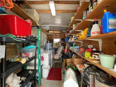 This charming residence boasts numerous delightful features. 2 on Indianwood Golf and Country Club in Florida - for sale on GolfHomes.com, golf home, golf lot