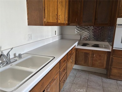 M6 143I. This partially extended unit is located in a central on Leisure World Seal Beach Golf Course in California - for sale on GolfHomes.com, golf home, golf lot