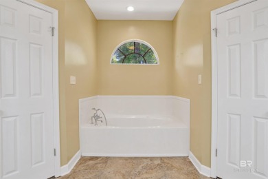 This spacious 4-bedroom, 2.5-bathroom home is perfectly situated on Lake Forest Yacht and Country Club in Alabama - for sale on GolfHomes.com, golf home, golf lot