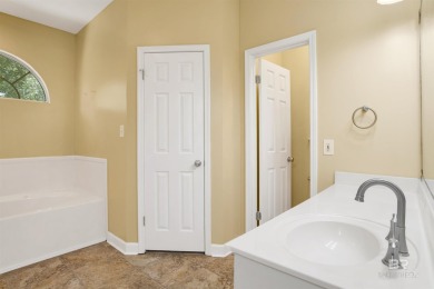 This spacious 4-bedroom, 2.5-bathroom home is perfectly situated on Lake Forest Yacht and Country Club in Alabama - for sale on GolfHomes.com, golf home, golf lot