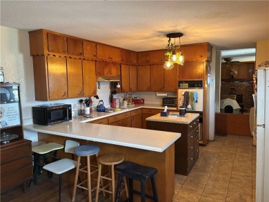 This Ranch style home features 3 beds and 2 baths, an open on Baxter Country Club in Kansas - for sale on GolfHomes.com, golf home, golf lot