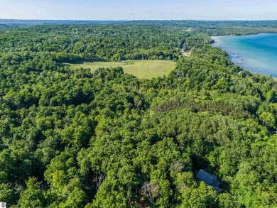 Tucked into the heart of Leelanau County, this beautifully treed on Manitou Passage Golf Club in Michigan - for sale on GolfHomes.com, golf home, golf lot