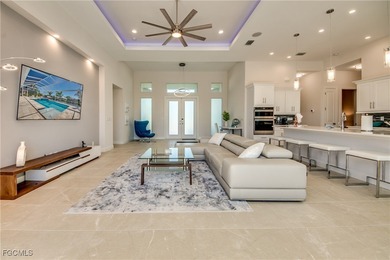 Experience true Florida living in this beautifully appointed on Royal Tee Country Club in Florida - for sale on GolfHomes.com, golf home, golf lot