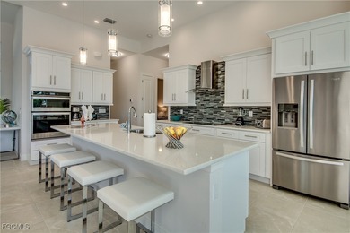 Experience true Florida living in this beautifully appointed on Royal Tee Country Club in Florida - for sale on GolfHomes.com, golf home, golf lot