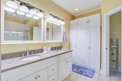 This custom Southern Living-style home sits on a tranquil pond on Santee National Golf Course in South Carolina - for sale on GolfHomes.com, golf home, golf lot
