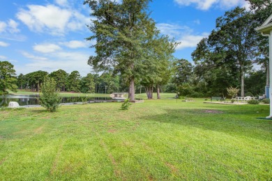This custom Southern Living-style home sits on a tranquil pond on Santee National Golf Course in South Carolina - for sale on GolfHomes.com, golf home, golf lot