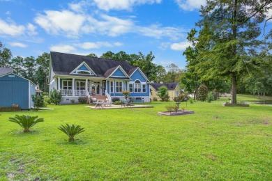 This custom Southern Living-style home sits on a tranquil pond on Santee National Golf Course in South Carolina - for sale on GolfHomes.com, golf home, golf lot