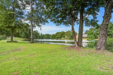 This custom Southern Living-style home sits on a tranquil pond on Santee National Golf Course in South Carolina - for sale on GolfHomes.com, golf home, golf lot
