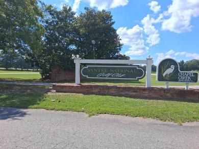 This custom Southern Living-style home sits on a tranquil pond on Santee National Golf Course in South Carolina - for sale on GolfHomes.com, golf home, golf lot