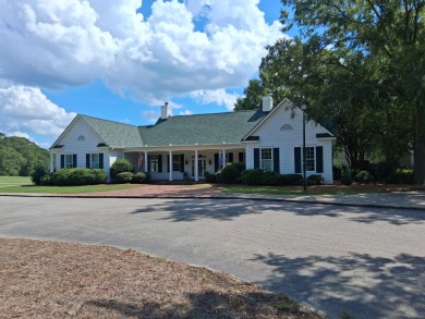 This custom Southern Living-style home sits on a tranquil pond on Santee National Golf Course in South Carolina - for sale on GolfHomes.com, golf home, golf lot