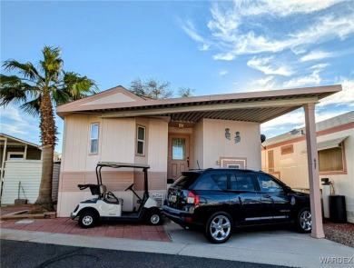 Gorgeous Golf Course Home. View of the pond and the lush green on Riverview Golf Course in Arizona - for sale on GolfHomes.com, golf home, golf lot