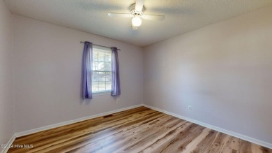 Inviting 3-Bedroom Brick Home with Sunroom Backing to the River on River Bend Golf and Country Club in North Carolina - for sale on GolfHomes.com, golf home, golf lot