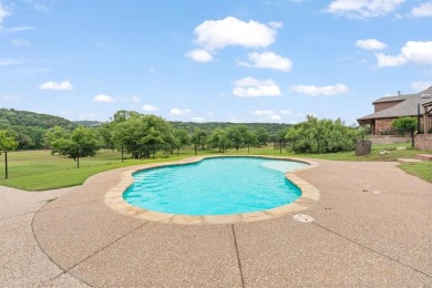 Private paradise nestled along the river with water views on Pecan Plantation Country Club in Texas - for sale on GolfHomes.com, golf home, golf lot