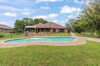 Private paradise nestled along the river with water views on Pecan Plantation Country Club in Texas - for sale on GolfHomes.com, golf home, golf lot
