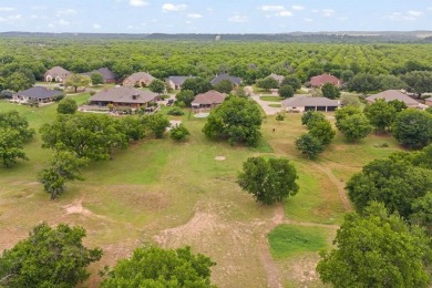 Private paradise nestled along the river with water views on Pecan Plantation Country Club in Texas - for sale on GolfHomes.com, golf home, golf lot