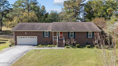 Inviting 3-Bedroom Brick Home with Sunroom Backing to the River on River Bend Golf and Country Club in North Carolina - for sale on GolfHomes.com, golf home, golf lot