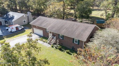 Inviting 3-Bedroom Brick Home with Sunroom Backing to the River on River Bend Golf and Country Club in North Carolina - for sale on GolfHomes.com, golf home, golf lot