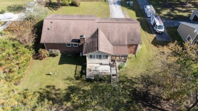 Inviting 3-Bedroom Brick Home with Sunroom Backing to the River on River Bend Golf and Country Club in North Carolina - for sale on GolfHomes.com, golf home, golf lot