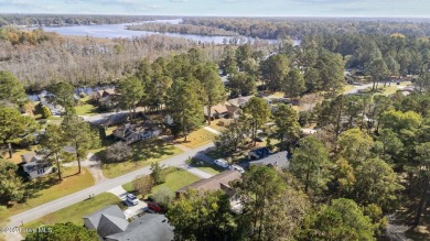 Inviting 3-Bedroom Brick Home with Sunroom Backing to the River on River Bend Golf and Country Club in North Carolina - for sale on GolfHomes.com, golf home, golf lot