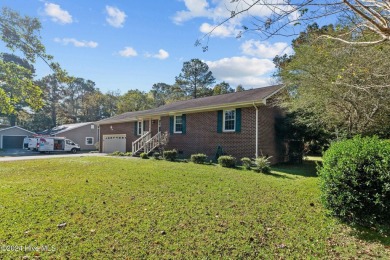 Inviting 3-Bedroom Brick Home with Sunroom Backing to the River on River Bend Golf and Country Club in North Carolina - for sale on GolfHomes.com, golf home, golf lot