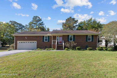 Inviting 3-Bedroom Brick Home with Sunroom Backing to the River on River Bend Golf and Country Club in North Carolina - for sale on GolfHomes.com, golf home, golf lot