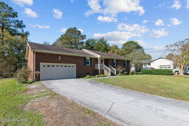 Inviting 3-Bedroom Brick Home with Sunroom Backing to the River on River Bend Golf and Country Club in North Carolina - for sale on GolfHomes.com, golf home, golf lot