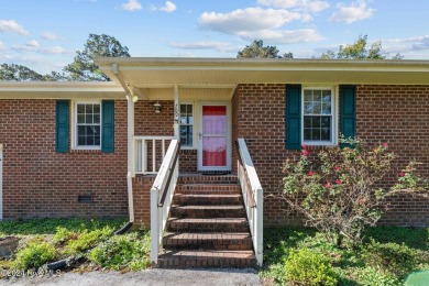 Inviting 3-Bedroom Brick Home with Sunroom Backing to the River on River Bend Golf and Country Club in North Carolina - for sale on GolfHomes.com, golf home, golf lot