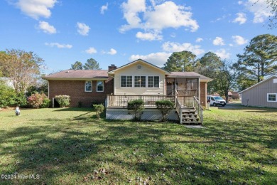 Inviting 3-Bedroom Brick Home with Sunroom Backing to the River on River Bend Golf and Country Club in North Carolina - for sale on GolfHomes.com, golf home, golf lot