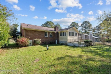 Inviting 3-Bedroom Brick Home with Sunroom Backing to the River on River Bend Golf and Country Club in North Carolina - for sale on GolfHomes.com, golf home, golf lot