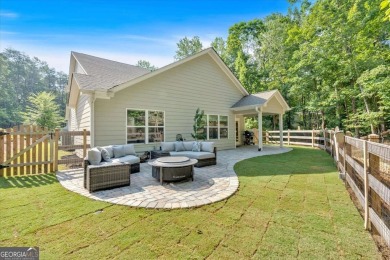 Discover the charm of this nearly new 2023 craftsman-style home on The Highlands Course at Lake Arrowhead in Georgia - for sale on GolfHomes.com, golf home, golf lot