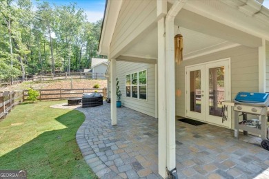 Discover the charm of this nearly new 2023 craftsman-style home on The Highlands Course at Lake Arrowhead in Georgia - for sale on GolfHomes.com, golf home, golf lot
