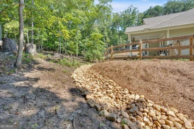 Discover the charm of this nearly new 2023 craftsman-style home on The Highlands Course at Lake Arrowhead in Georgia - for sale on GolfHomes.com, golf home, golf lot