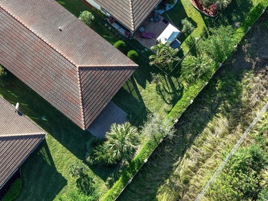 This beautifully maintained home offers the perfect blend of on PGA Golf Club in PGA Village in Florida - for sale on GolfHomes.com, golf home, golf lot