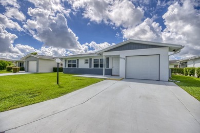 where over $50,000 in major upgrades--including hurricane impact on Cypress Lakes Golf Course - West Palm Beach in Florida - for sale on GolfHomes.com, golf home, golf lot