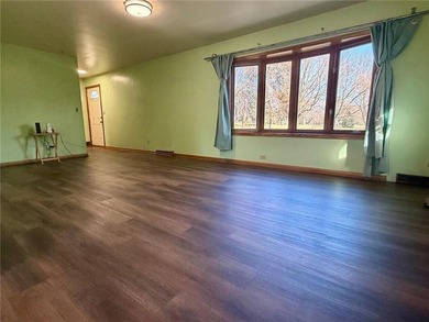 Enjoy golf-course living at its finest. Welcome to this inviting on Worthington Country Club in Minnesota - for sale on GolfHomes.com, golf home, golf lot