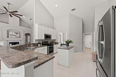 Beautiful 4-bedroom, 3-bath home overlooking the water and the on Eagle Harbor Golf Club in Florida - for sale on GolfHomes.com, golf home, golf lot