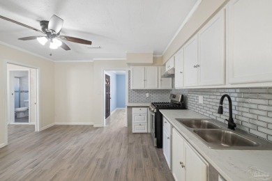 Discover an incredible opportunity to own a 4-bedroom brick home on Tiger Point Golf and Country Club in Florida - for sale on GolfHomes.com, golf home, golf lot