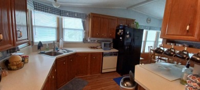 Come settle down and relax in a beautiful manufactured home with on Fairways Country Club in Florida - for sale on GolfHomes.com, golf home, golf lot