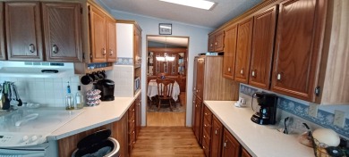 Come settle down and relax in a beautiful manufactured home with on Fairways Country Club in Florida - for sale on GolfHomes.com, golf home, golf lot