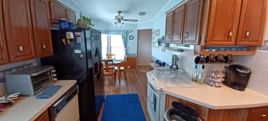 Come settle down and relax in a beautiful manufactured home with on Fairways Country Club in Florida - for sale on GolfHomes.com, golf home, golf lot